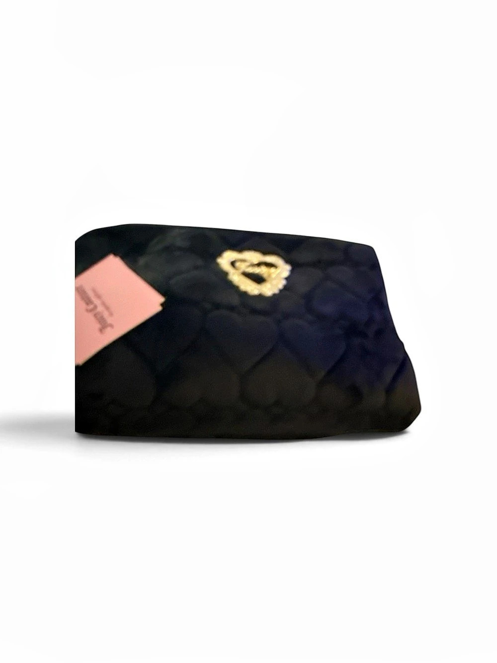 Juicy Couture Black Heart Quilted Cosmetic Bag in Black with a travel toiletry b